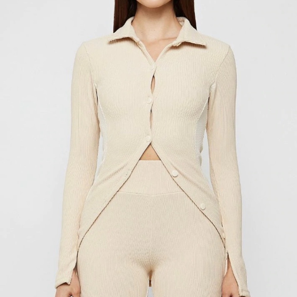 Size 4, beige color, open front button top. Can be dressed up or down